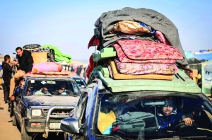 Displaced again, Gazans flee under fire