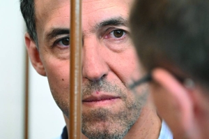 Russian court orders to keep French researcher in jail as trial starts