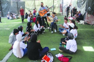 Teen musician sings for children who endure the horrors of conflict