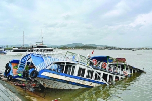 Typhoon weakens after leaving dozens dead in Vietnam, China and Philippines