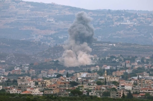 Hezbollah missiles hit Haifa, Israel steps up bombings in south Lebanon