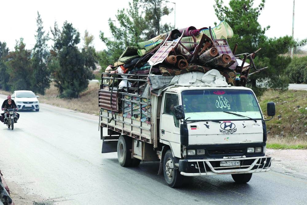 Fear and protests as Syria rebels advance on Damascus