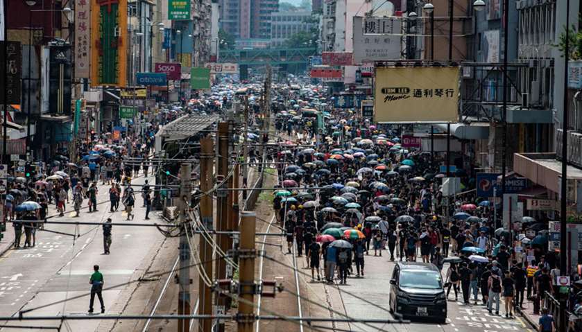 Protesters attend a march the Yuen Long district of Hong Kong