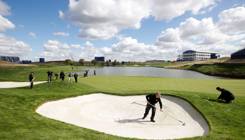 Groundstaff prepare the golf course