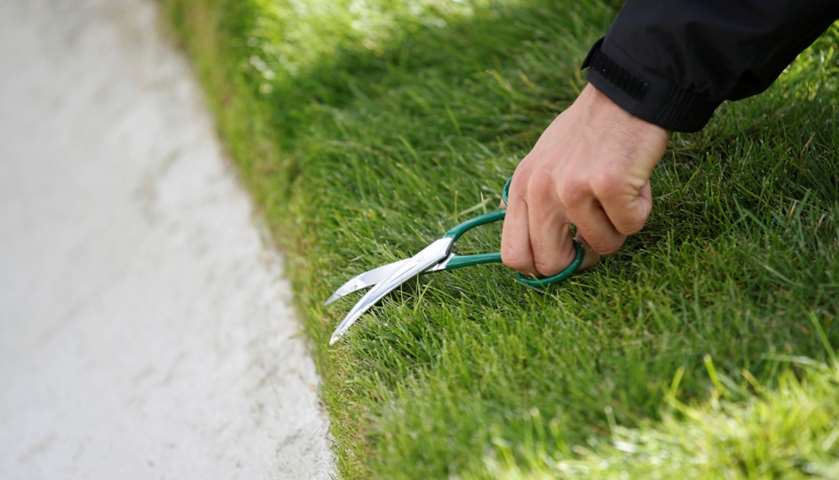 Groundstaff prepare the golf course