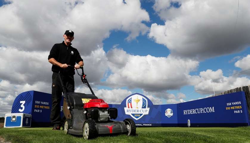 Groundstaff prepare the golf course