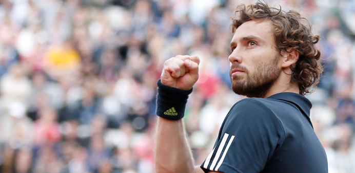 Ernests Gulbis of Latvia celebrates after beating Tomas Berdych of the Czech Republic during their French Open quarter-final.  (EPA)