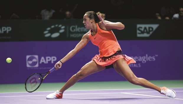 Madison Keys of the US returns during her win over Dominika Cibulkova of Slovakia at the WTA Finals round robin match in Singapore yesterday. (Reuters)