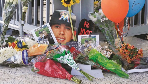 In this file photo, a memorial of flowers and photos are placed outside a gate at Marlins Park in honour of Marlins starting pitcher Jose Fernandez, who was killed in a boating accident in Miami, Florida, in September this year. (USA Today-Sports)