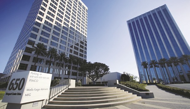 The offices of Pacific Investment Management Co (left) are seen in Newport Beach, California. Pimco and Aberdeen Asset Management are trimming exposure to a rupee bond rally thatu2019s driven yields to seven-year lows, concerned the central bank will be cautious on monetary policy.