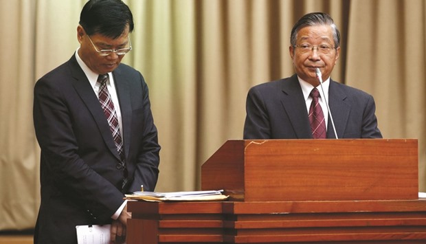 Financial Supervisory Commission chairman Ding Kung-Wha (left) and Mega Financialu2019s chairman Michael Chang attend a parliamentary session at Legislative Yuan in Taipei. Ding had been criticised over his handling of the controversy involving Mega  International Commercial Bank, which was hit with a $180mn fine in the US in August.