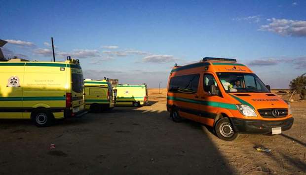 Ambulances parked in the desert towards the Bahariya oasis in Egypt's Western desert, about 135 kilometres southwest of Giza, near the site of an attack that left dozens of police officers killed in an ambush by Islamist fighters.