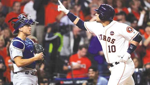 Yuli Gurriel of the Houston Astros celebrates after hitting a