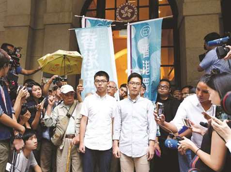 Pro-democracy activists Joshua Wong (left) and Nathan Law walk out of the Court of Final Appeal after being granted bail in Hong Kong, earlier this month.