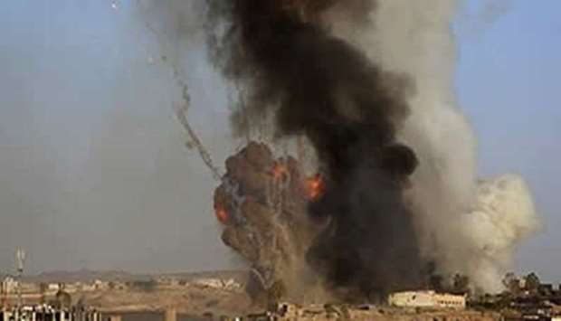 Fire and smoke rise after raids targeted Baqem district of Saada province. File picture