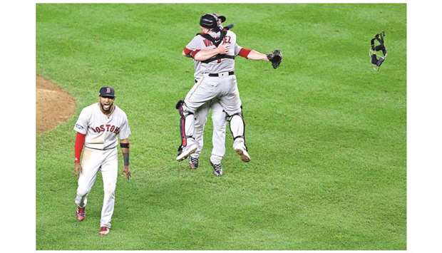 Boston Red Sox catcher Christian Vazquez, left, and relief pitcher