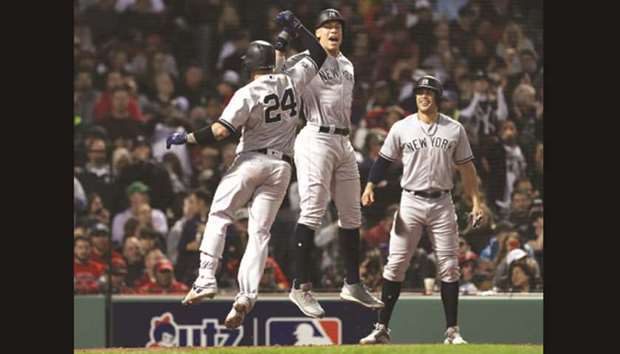 New York Yankees' Aaron Judge, left, celebrates with Gary Sanchez