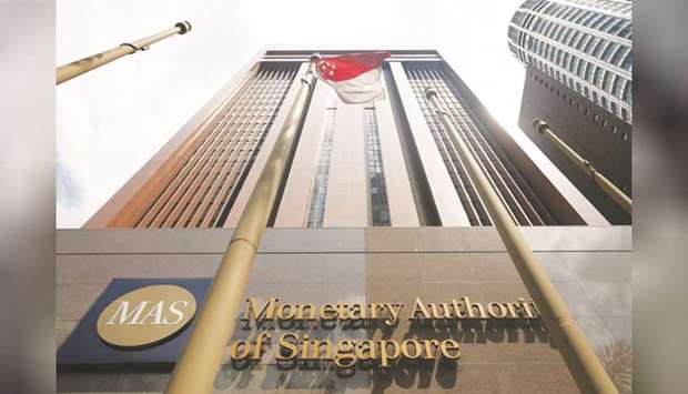 A view of the Monetary Authority of Singaporeu2019s headquarters. A majority of the economists surveyed by Bloomberg predict the Monetary Authority of Singapore will reduce the slope of its currency band by 50 basis points on Monday, implying a more gradual pace of appreciation in the local dollar.