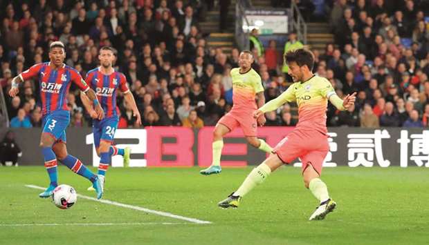 Manchester Cityu2019s David Silva (right) scores the teamu2019s second goal during the Premier League match against Crystal Palace in London yesterday. (Reuters)