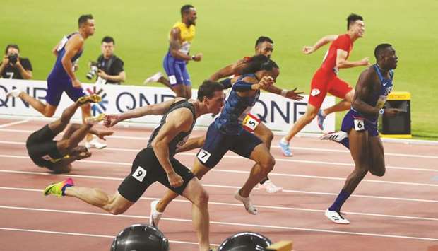 Grant Holloway (right) of the US sprints to victory in the menu2019s 110m hurdles final during the World Athletics Championships at the Khalifa International Stadium in Doha on Wednesday night. (Reuters)