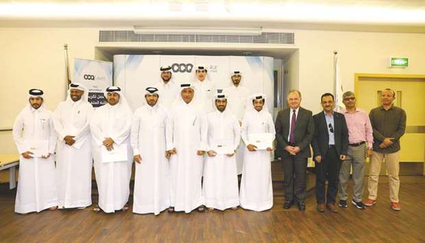 Dr Mohamed al-Naemi, Dr Khalid al-Abdulqader and Dr Robert Ford with the honoured students, alongside faculty members.