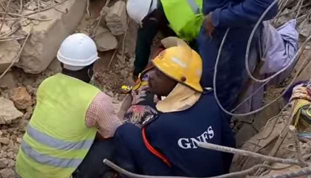 Rescue workers remove debris to get trapped victims out.