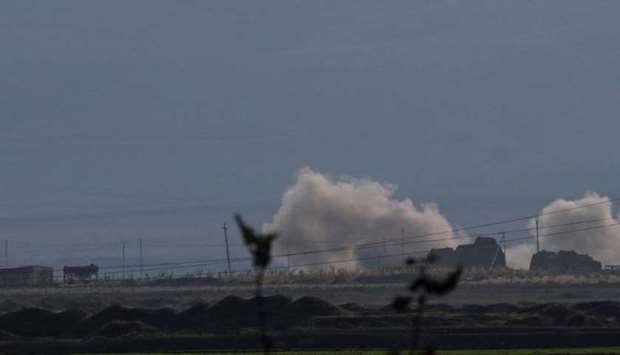 Smoke rises as Azerbaijan forces shell targets during the fighting over the breakaway region of Nagorno-Karabakh near the city of Terter, Azerbaijan