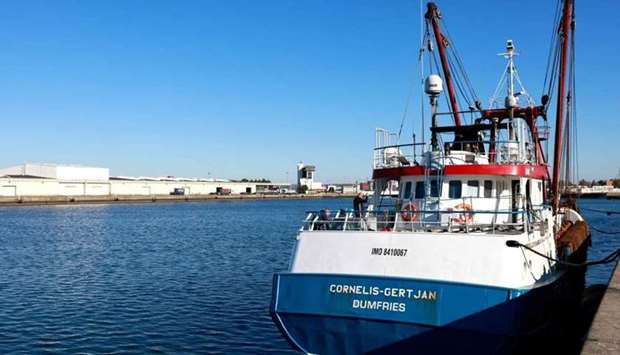 British fishermen stand on the trawler 'Cornelis-Gert Jan' in the harbour of Le Havre, northern France, after it was detained by French authorities