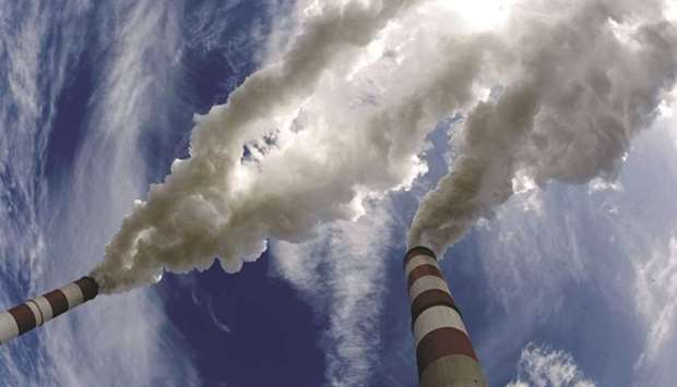 Smoke billows from the chimneys of a power station, in this file photo. (Reuters)