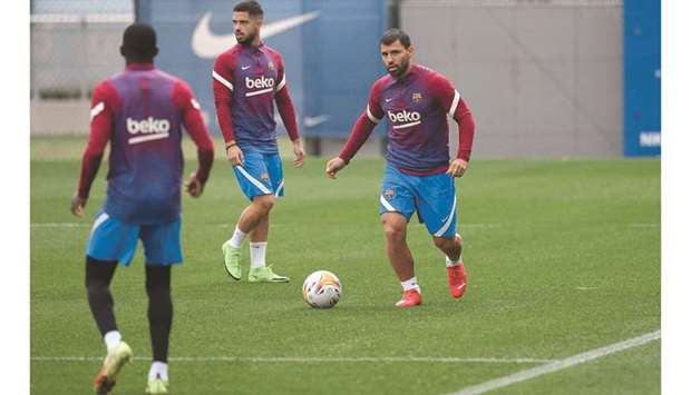 Barcelonau2019s Argentinian forward Sergio Aguero (right) attends a training session with teammates in Barcelona yesterday. (AFP)