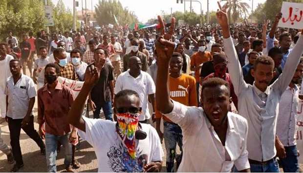 Sudanese anti-coup protesters block a street in the Red Sea city of Port Sudan.