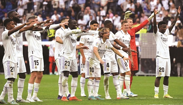 Real Madridu2019s players celebrate after their win over Barcelona in the La Liga at the Santiago Bernabeu Stadium in Madrid yesterday. (AFP)