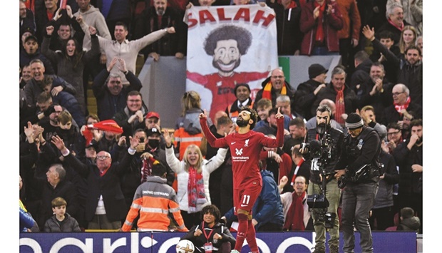 Liverpoolu2019s Mohamed Salah celebrates after scoring against Manchester City during the Premier League match at Anfield in Liverpool, northwest England, yesterday. (AFP)