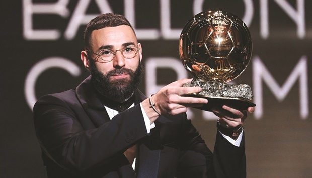 Real Madridu2019s French forward Karim Benzema poses with the Ballon du2019Or award during the 2022 Ballon du2019Or France Football award ceremony at the Theatre du Chatelet in Paris on Monday. (AFP)