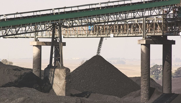 A conveyor bridge over piles of coal at the Mafube open-cast coal mine, operated by Exxaro Resources and Thungela Resources, in Mpumalanga, South Africa. Some of the worldu2019s biggest financial firms including BlackRock and Vanguard have told the UK they have no plans to halt the financing of new fossil-fuel supplies, in response to a list of questions sent by British lawmakers tasked with figuring out how the country can meet its own net-zero obligations.