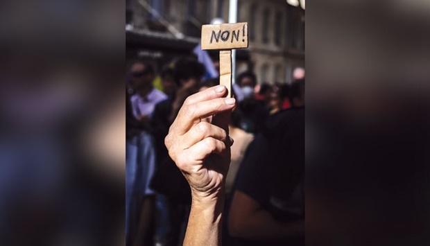 A man hold a mini-sign that reads u2018Nou2019 during a demonstration yesterday in the western French city of Bordeaux, after the CGT and FO trade unions called for a nationwide strike for higher salaries, and against the governmentu2019s requisitioning of fuel refineries to force some strikers back into opening fuel depots.
