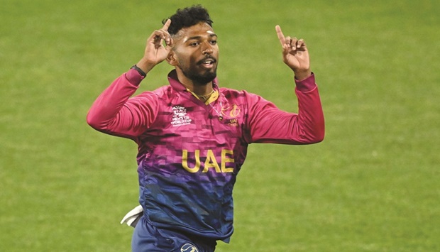 UAEu2019s Karthik Palaniapan Meiyappan celebrates his hat-trick during the ICC Twenty20 World Cup 2022 match against Sri Lanka at Kardinia Park in Geelong yesterday. (AFP)