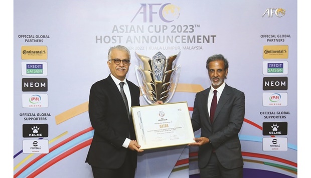 Qatar Football Association President Sheikh Hamad bin Khalifa bin Ahmed al-Thani with AFC President Shaikh Salman bin Ebrahim al-Khalifah after Qatar was awarded the rights to host the AFC Asian Cup 2023.