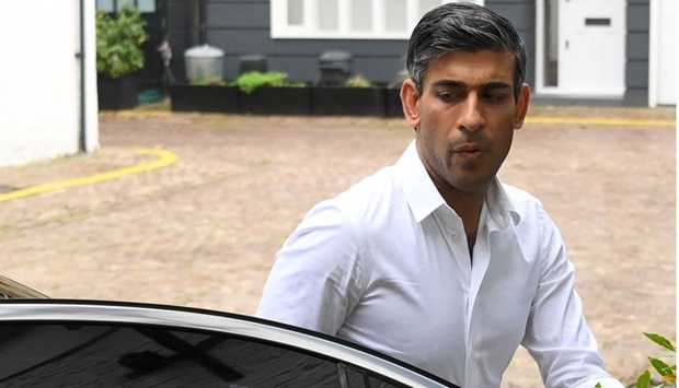 Britain's former Chancellor of the Exchequer, Conservative MP, Rishi Sunak arrives back at his home in London on Saturday. AFP