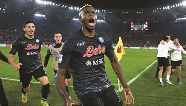 Napoliu2019s Victor Osimhen celebrates after scoring against Roma in Serie A at the Stadio Olimpico in Rome. (Reuters)