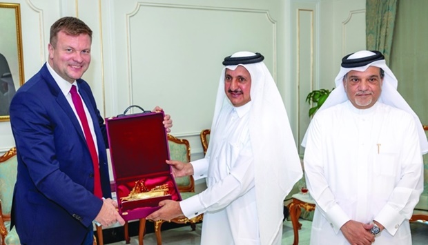 Qatar Chamber chairman Sheikh Khalifa bin Jassim al-Thani handing over a token of recognition to Finlandu2019s Minister for Development Co-operation and Foreign Trade, Ville Skinnari, during a meeting held recently in Doha.