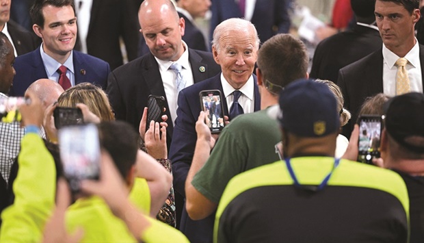 US President Joe Biden speaks with attendees after delivering remarks on the economy after touring the Volvo Group Powertrain facility in Hagerstown, Maryland, yesterday.