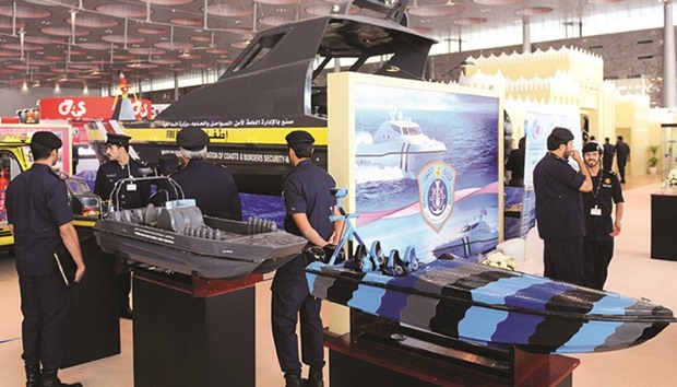 An actual fire fighting vessel and miniature models of other vessels on display at Coastguards pavilion at Milipol Qatar Exhibition yesterday. PICTURE: Shaji Kayamkulam