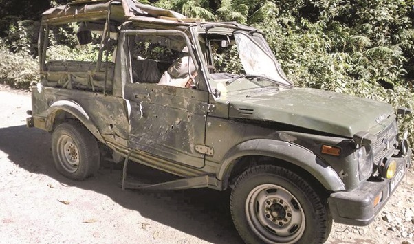 Bullet marks are seen on a damaged army vehicle at Pengeri in Assamu2019s Tinsukia district yesterday following an ambush attack by armed militants.