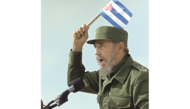 A May 25, 2002 file photo of Cuban President Fidel Castro holding a Cuban flag while addressing a meeting in Sancti-Spiritus, some 340km east of Havana.