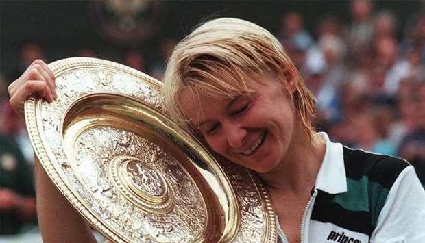 Czech Republic's Jana Novotna enjoying her championship trophy after winning the final of the women's singles at the Wimbledon Tennis Championships in 1998