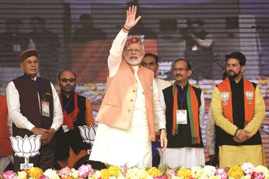 Prime Minister Narendra Modi waves to the crowd during an election rally ahead of state assembly elections in Una in Himachal Pradesh yesterday.