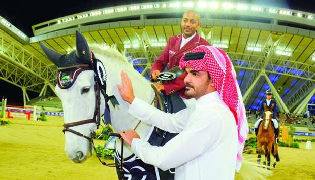 Qatar Olympic Committee President HE Sheikh Joaan bin Hamad al-Thani congratulates Qatar rider Bassem Hassan Mohamed after he won the CSI5* speed class at the Global Champions Tour at Al Shaqab Friday. Bassem, astride 12-year-old gelding Argelith Squid, delighted the holiday crowd with his spectacular performance underlining his status as one of the most promising equestrian talents in the region.