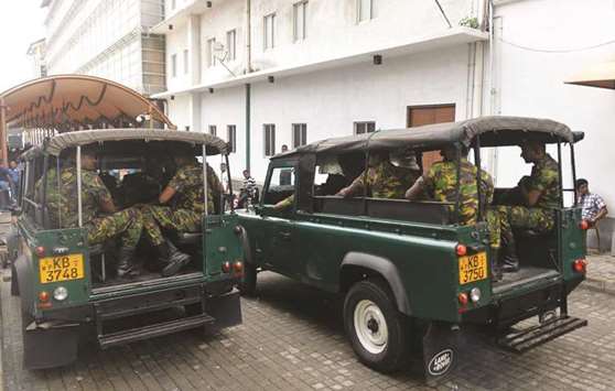 Sri Lankan Special Task Force (STF) soldiers leave the prime ministeru2019s official residence in Colombo yesterday.