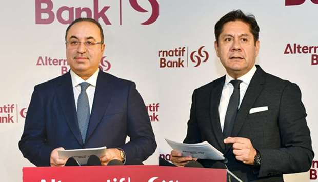 Alternatif Bank chairman and Commercial Bank managing director Omar Hussain Alfardan (left) and Alternatif Bank CEO Kaan Gu00fcr speaking at the opening ceremony of the new head office of Alternatif Bank at Vadistanbul in Istanbul yesterday.